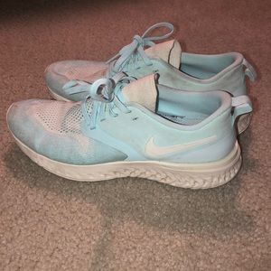 Mint blue and white Nike running shoes